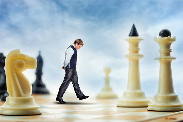 istock Businessman on the chess board 519926832