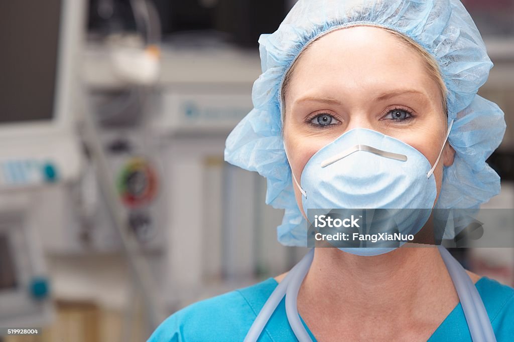 Nurse wearing a face mask Protective Workwear Stock Photo