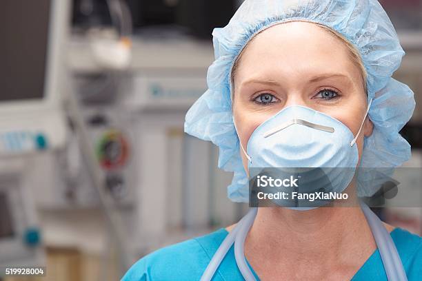 Nurse Wearing A Face Mask Stock Photo - Download Image Now - Protective Workwear, Nurse, Protective Face Mask