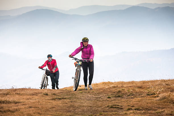 istock Biker riding in autumn mountains 519929680