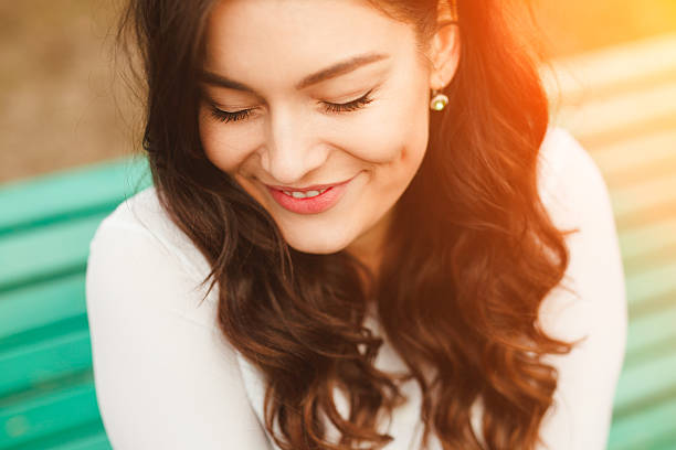 istock Close up pretty brunette girl dreaming with eyes closed 519929708