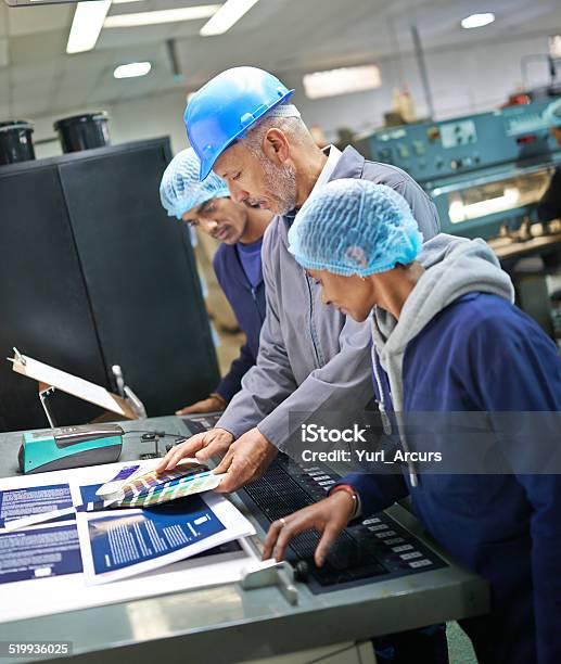 Managing The Process From Start To Finish Stock Photo - Download Image Now - Occupation, Printer - Occupation, Coveralls