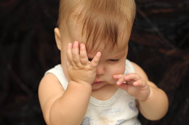 istock baby rubbing his eyes 519936931