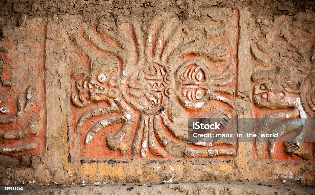 Decoration - Huacas del Moche Ancient decoration on the on the Huacas de Moche, temples of the Moche Culture?  The Huaca del Sol and Huaca de la Luna are both  adobe brick temples built by the Moche civilization (100 CE to 800 CE) on the northern coast of what is now Peru. The temples are two of several ruins found near the volcanic peak of Cerro Blanco, in the coastal desert near Trujillo at the Moche Valley. The Huaca de la Luna, is  better-preserved but smaller than Huaca del Sol. Adobe - Material Stock Photo