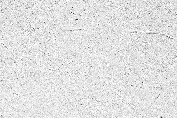 istock White painted wooden plywood wall. Background texture 519939101