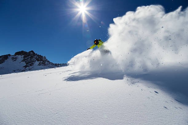 istock Alpine skier on piste, skiing downhill 519939291