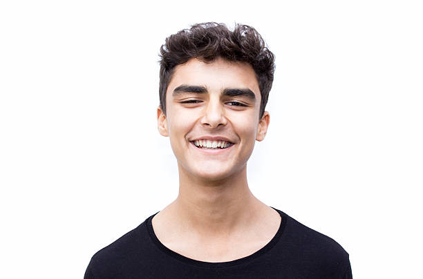 istock Portrait of laughing boy over white background 519953890