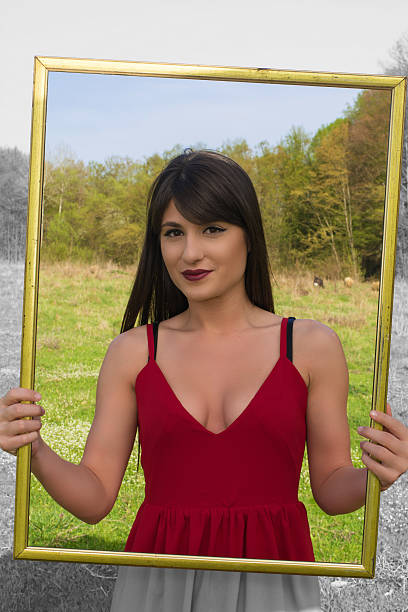 istock Young woman with picture frame 519955810