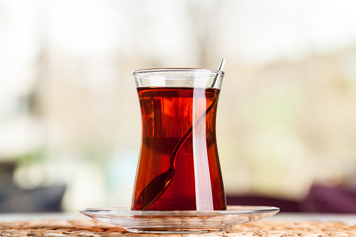 A glass of turkish tea with smoot background