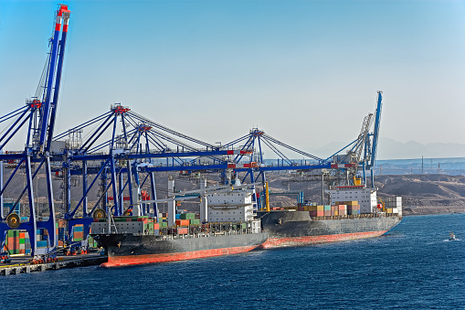 Ships moored on container terminal of port Aqaba, Red Sea, Jordan