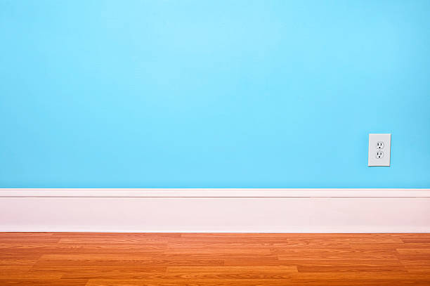 istock Empty interior room with light blue walls and hardwood floor 519959252