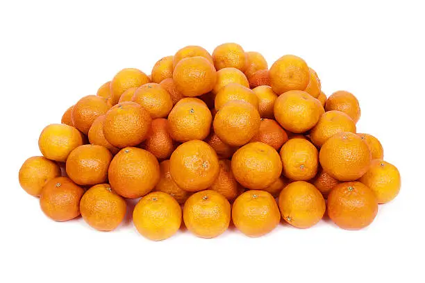 Heap of lush textured mandarins isolated on the white background