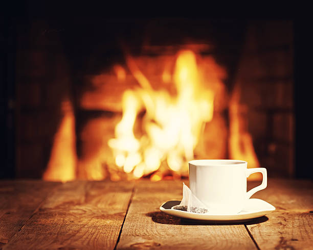 istock White cup of tea with teabag on wooden table. 519962390