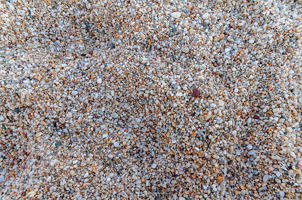 istock Naturally rounded gravel at sea shore, nature background texture pattern 519963370