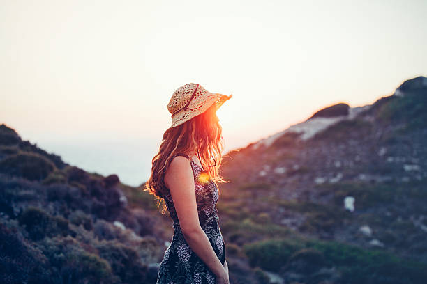 istock Boho girl enjoying nature with summer sunflare 519963874