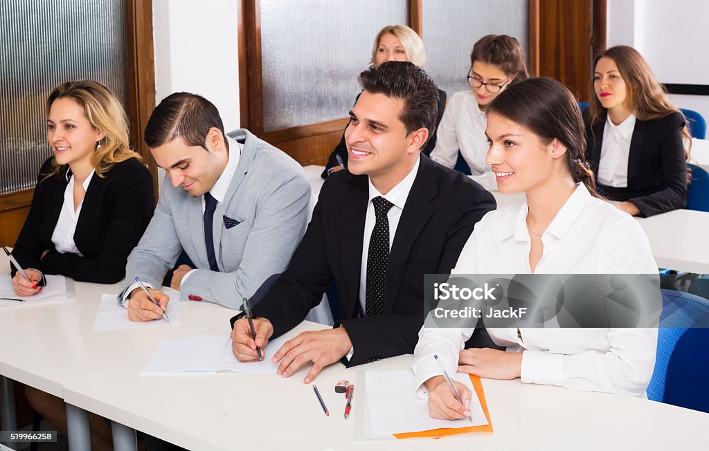 Professor and professionals at courses Professor and positive professionals at extension business courses together 30-39 Years Stock Photo