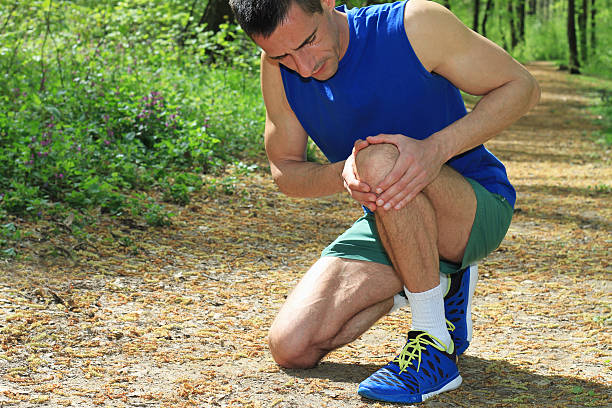 istock Knee injury, Man runner with knee pain 519966354