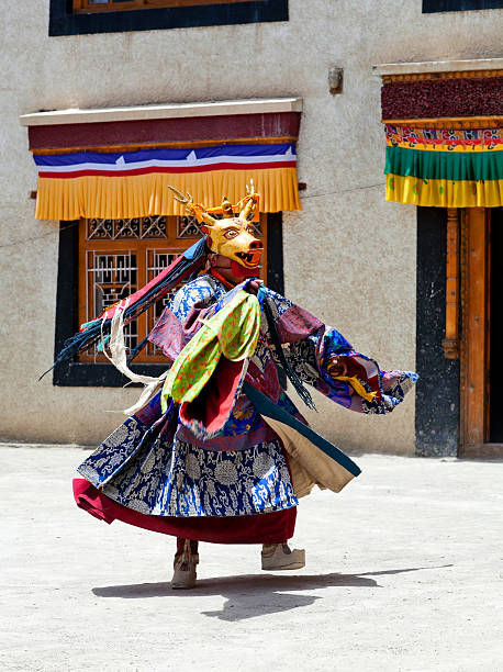 Cham Dance in Lamayuru Gompa in Ladakh, North India Lamayuru, India - June 17, 2012: Buddhist monk in Deer mask dancing Cham mystery during Yuru Kabgyat festival at Lamayuru Gompa in Ladakh, Jammu and Kashmir, North India cham mask stock pictures, royalty-free photos & images