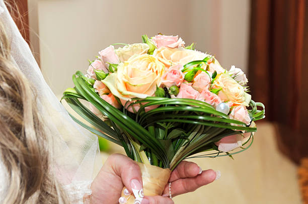istock wedding bouquet of cream roses 519967082