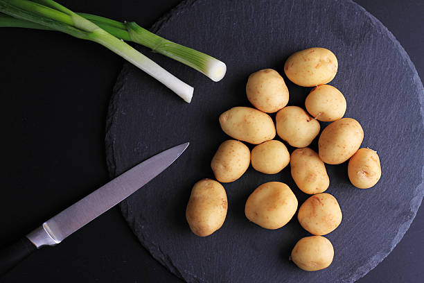 istock New potatoes, green onion. Fresh, raw, organic vegetables 519969372