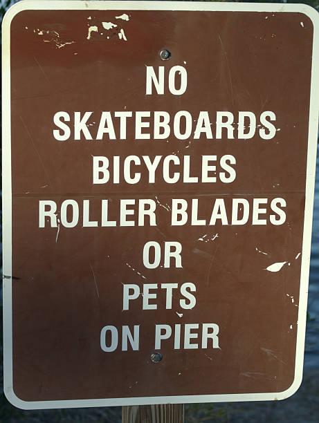 istock No Skateboards, bicycles, roller blades, or pets on pier 519970839