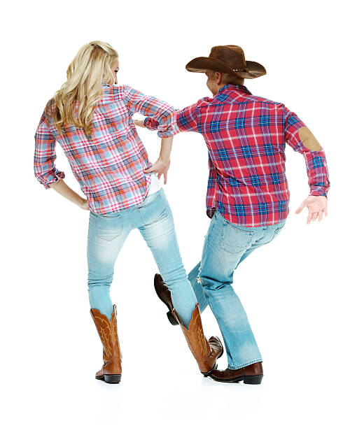 istock Rear view of cowboy couple dancing 519973325