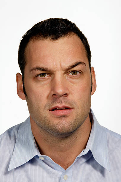 istock Young man making face, portrait, close-up 519973469