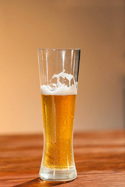 istock Glass of beer standing on the table 519975153