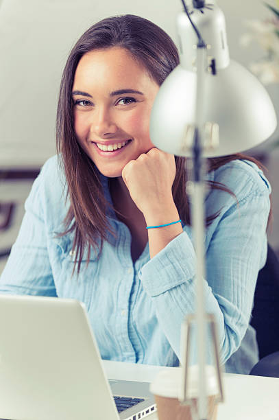 istock Businesswoman sitting at her desk with laptop computer. 519975885