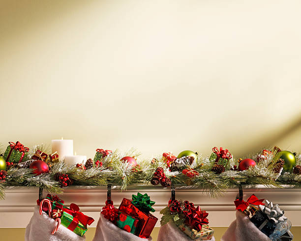 istock Christmas Stockings Hanging On Mantlepiece 519975899