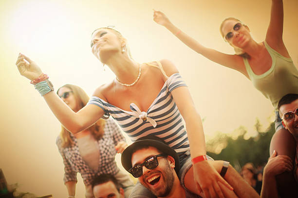 istock Young adults having fun at concert. 519975931
