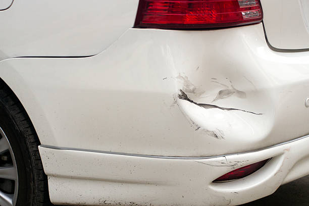 White dented car, broken car stock photo