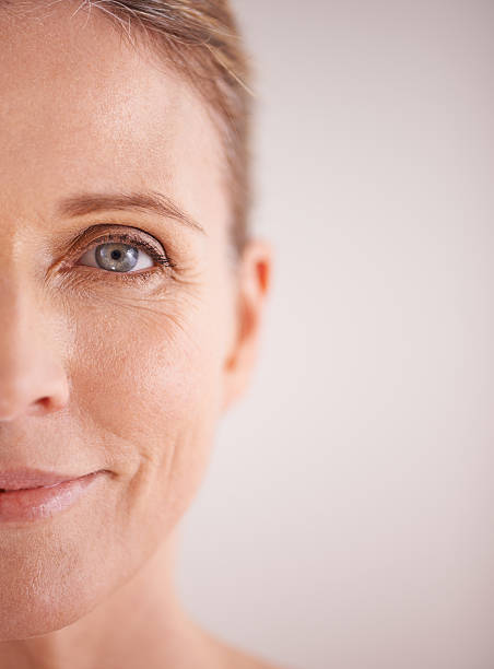 Naturally beautiful Cropped shot of a beautiful mature woman's face eye closeup stock pictures, royalty-free photos & images