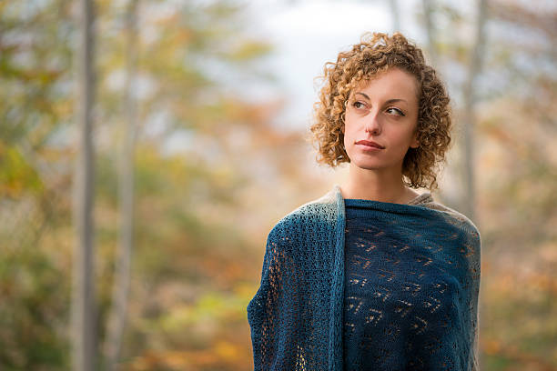 Beautiful woman in autumn forest