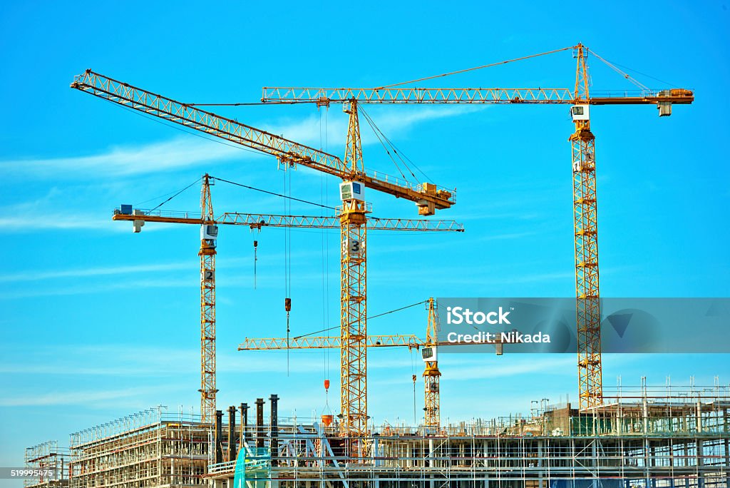 Construction site Cranes on a construction site in Berlin, Germany Apartment Stock Photo