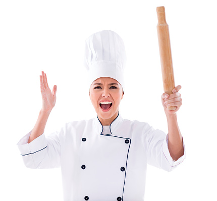 Angry chef yelling and holding a rolling pin