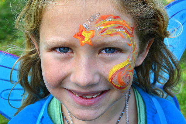 istock Girl wearing face paint 519998289