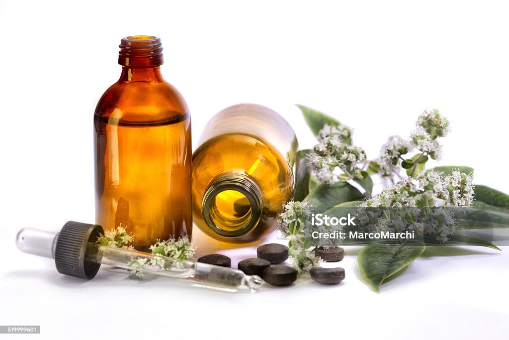 Alternative medicine Organic pills on mint leaves,  Alejandro Foglia Stock Photo