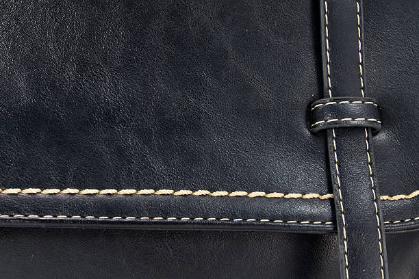 istock Background of seam and texture on handbag 519999875