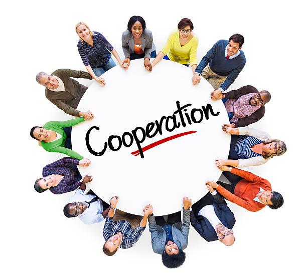 istock Diverse People in a Circle with Word Cooperation 520000223