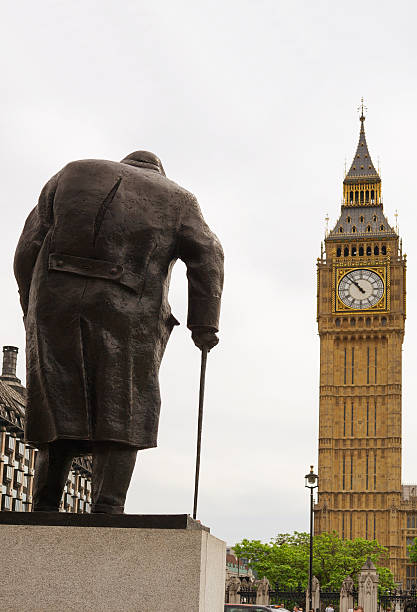 Winston Churchill, London, UK London, United Kingdom - May 21, 2014:  The bronze statue of Winston Churchill who was the British Prime Minister during the Second World War. The statue was erected in 1973 and was created by the sculptor Ivor Roberts-Jones, it  stands facing Big Ben and The Houses Of Parliament in London, England. winston churchill prime minister stock pictures, royalty-free photos & images