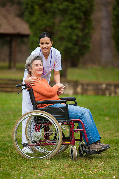 istock female nurse with senior woman 520001256