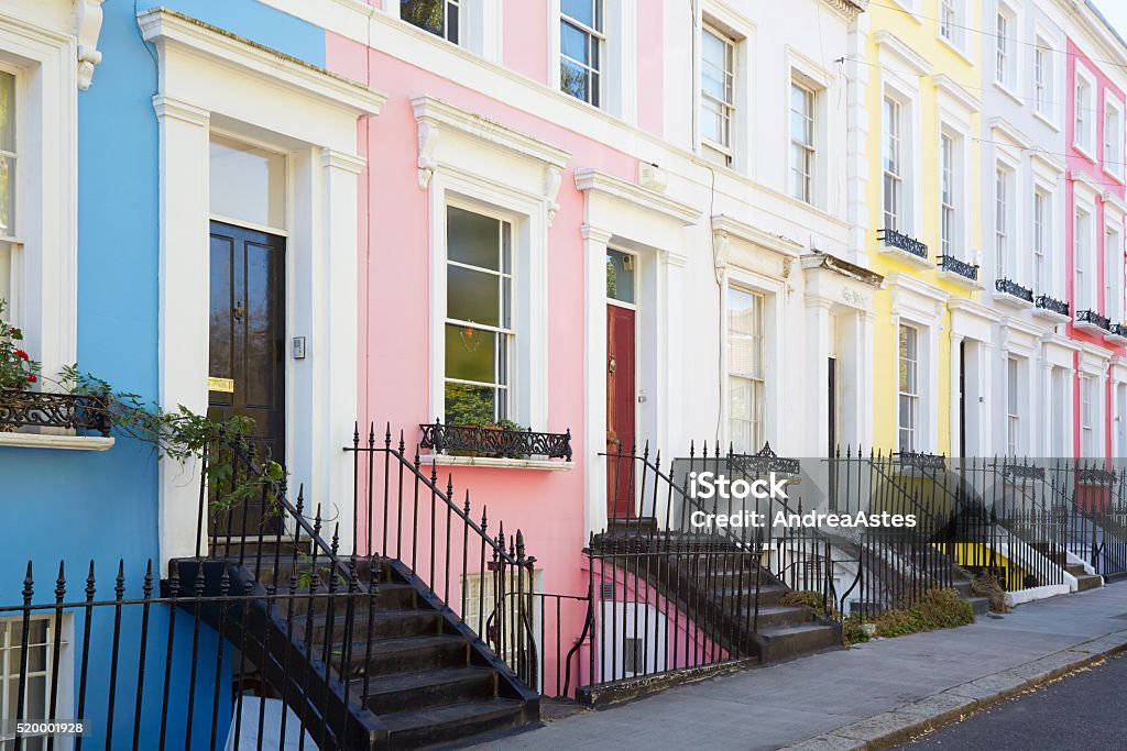Colorful English houses facades in London Colorful English houses facades in blue, pink, yellow and white, pastel colors in London House Stock Photo