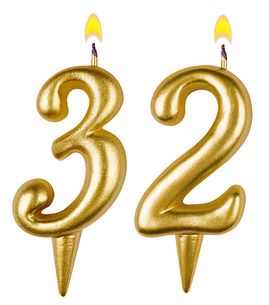 istock Birthday candles number thirty two isolated on white background 520002195