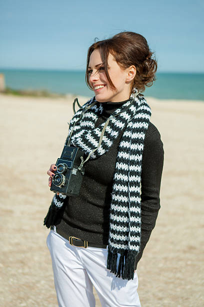 istock Beach woman with vintage retro camera 520002380