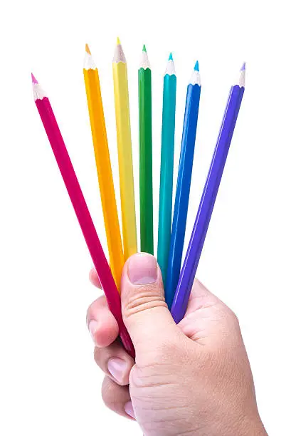 Photo of Person Holding Multicoloured Pencils