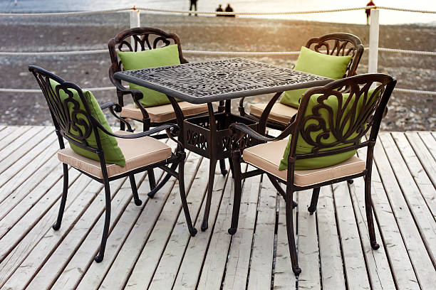 istock Wrought-iron table on the terrace on the beach in the sunset 520003468