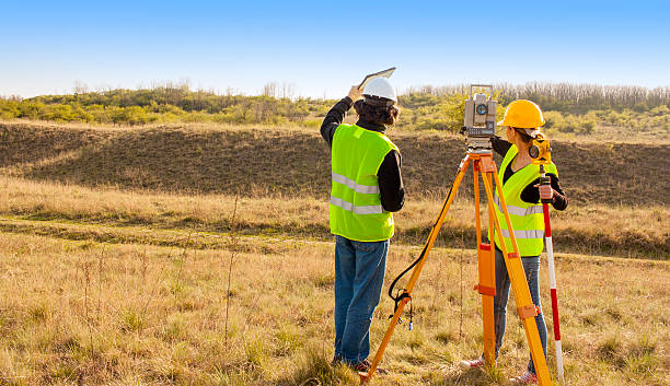Engineers at work Engineers at work surveyor photos stock pictures, royalty-free photos & images