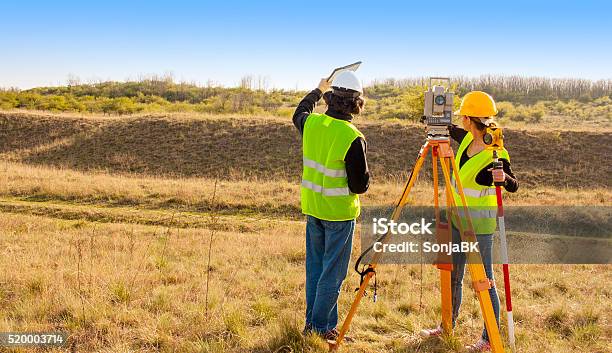 Engineers At Work Stock Photo - Download Image Now - Surveyor, Land, Topography