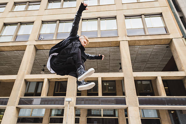 istock Stylish bearded man jumping in the street 520006474